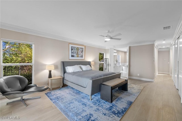 bedroom featuring ceiling fan, light hardwood / wood-style flooring, ensuite bathroom, and ornamental molding