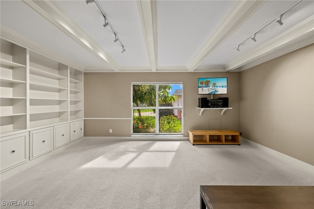 unfurnished living room with light colored carpet, built in shelves, and beamed ceiling