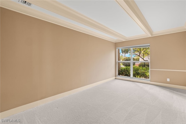 carpeted spare room with crown molding and beam ceiling