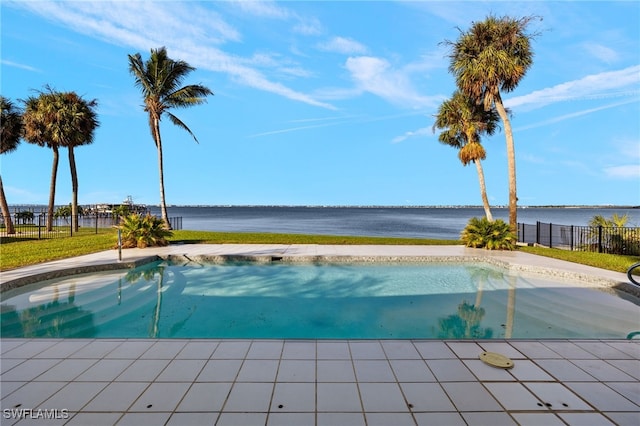 view of swimming pool with a water view