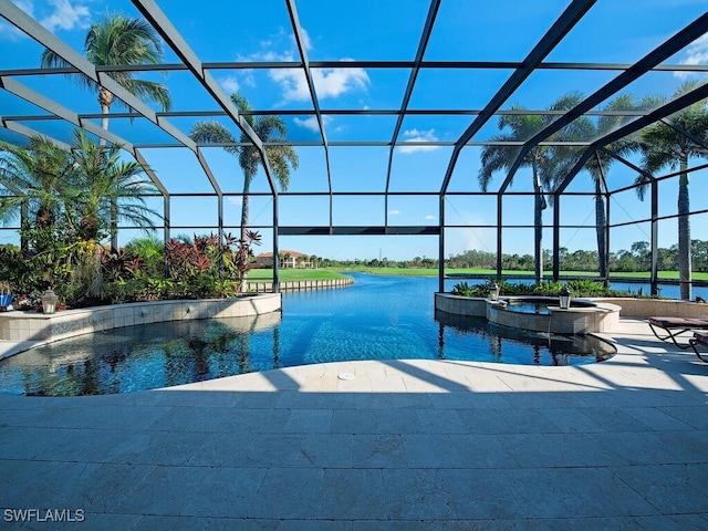 view of swimming pool with a lanai, a water view, a patio, and an in ground hot tub