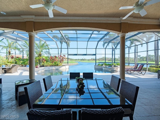 view of patio / terrace with ceiling fan and glass enclosure