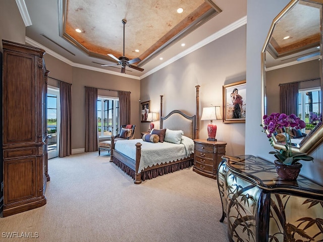 carpeted bedroom featuring ceiling fan, access to exterior, crown molding, and a raised ceiling