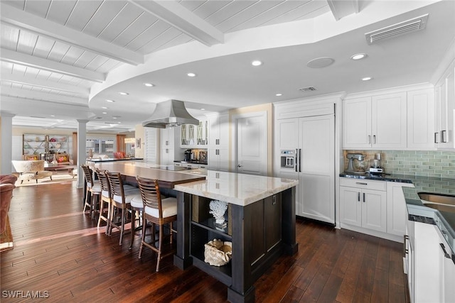 kitchen featuring island range hood, a center island, wood ceiling, white cabinetry, and beamed ceiling