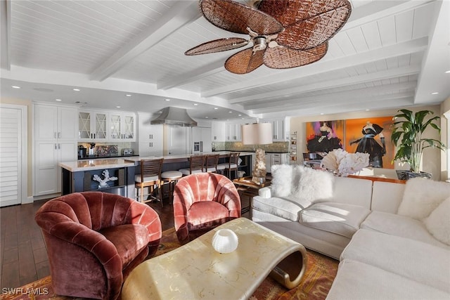 living room featuring ceiling fan, dark wood-type flooring, and beamed ceiling