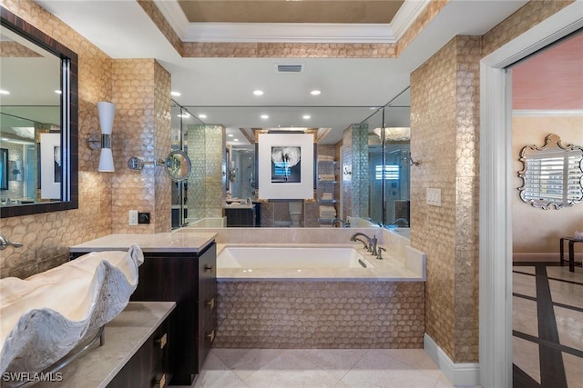 bathroom with tile patterned flooring, crown molding, and a tray ceiling