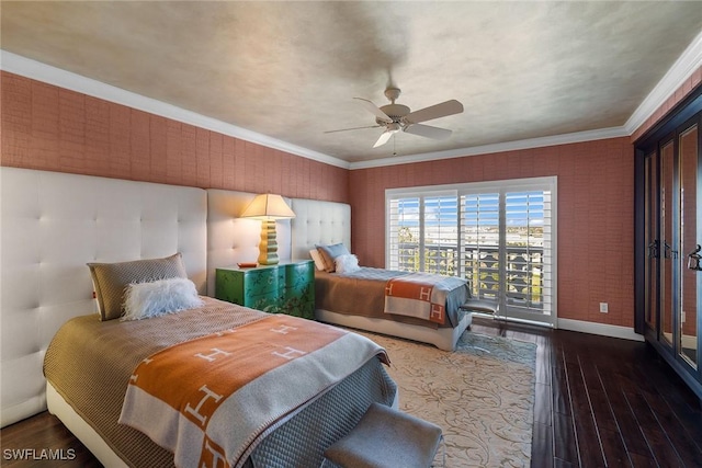 bedroom featuring dark hardwood / wood-style flooring, access to exterior, ceiling fan, and crown molding