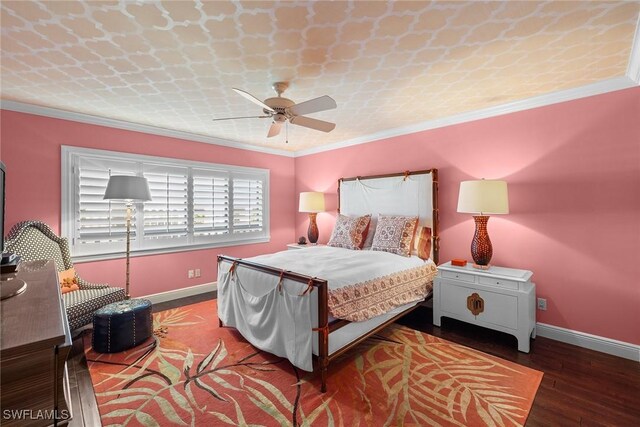 bedroom with dark wood-type flooring, ceiling fan, and crown molding