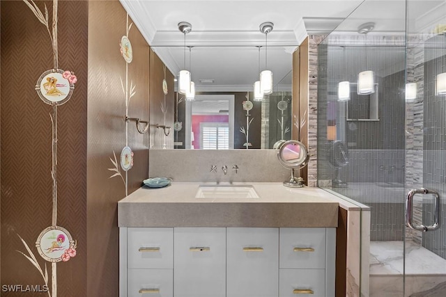 bathroom featuring a shower with shower door, crown molding, and vanity