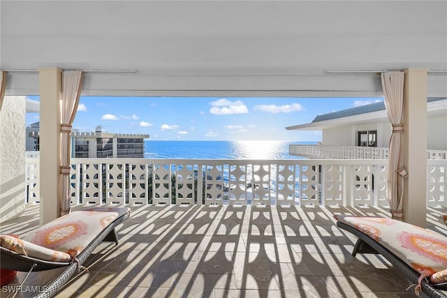 balcony featuring a water view