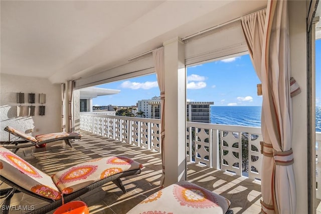 balcony featuring a water view