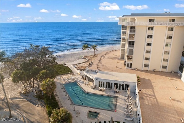 birds eye view of property featuring a view of the beach and a water view