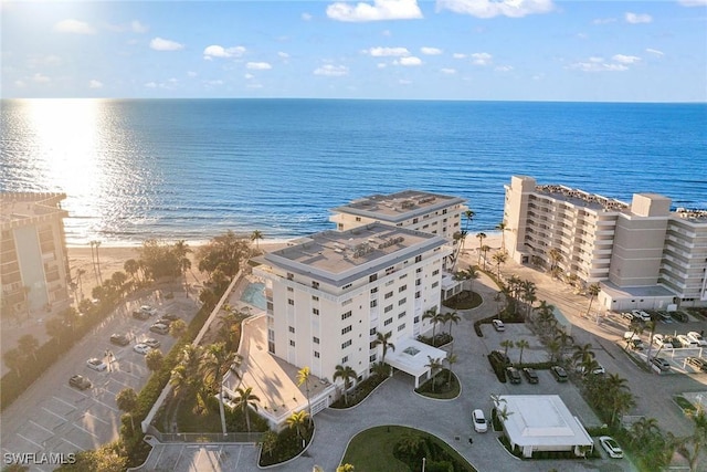 drone / aerial view featuring a view of the beach and a water view