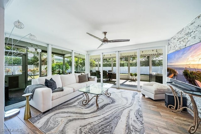 sunroom / solarium with ceiling fan