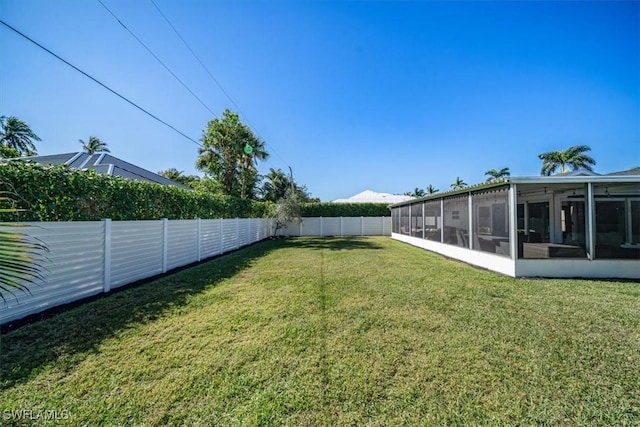 view of yard with a sunroom