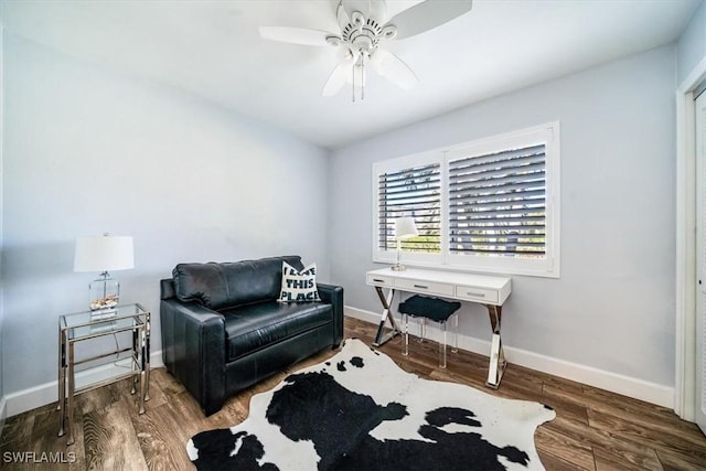 living area with ceiling fan and hardwood / wood-style flooring