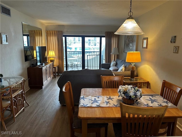 dining room with dark hardwood / wood-style floors