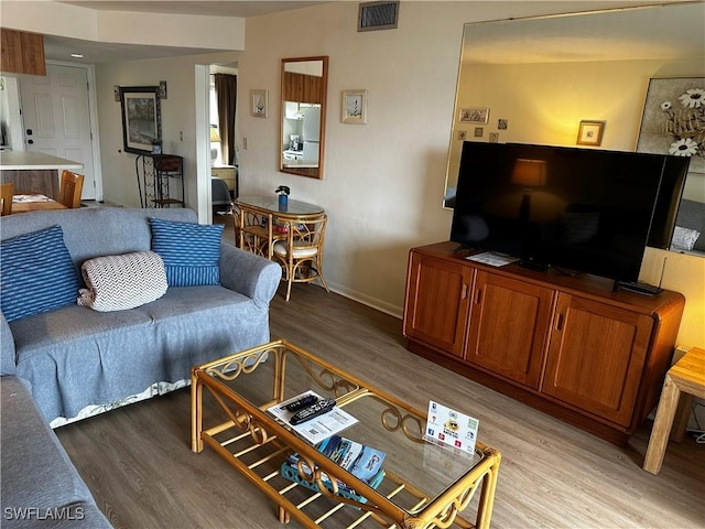 living room with light hardwood / wood-style flooring