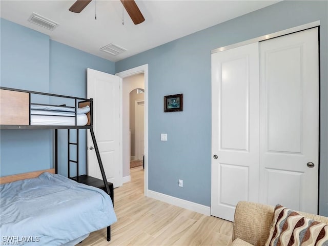 bedroom with ceiling fan and a closet