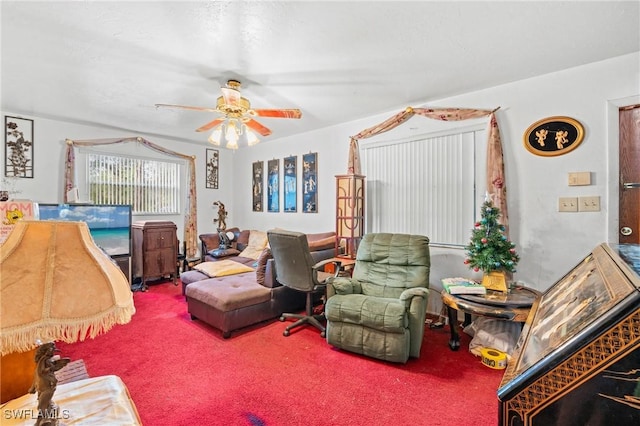 carpeted living room featuring ceiling fan