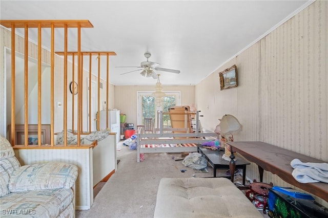 interior space featuring ceiling fan, light carpet, and crown molding