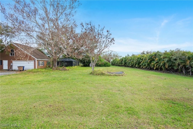 view of yard with a garage