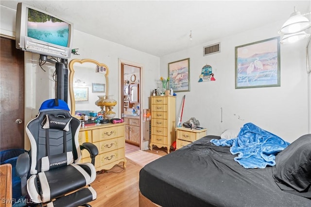 bedroom featuring wood-type flooring