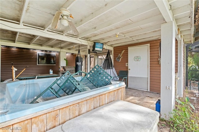 view of patio featuring ceiling fan and water heater