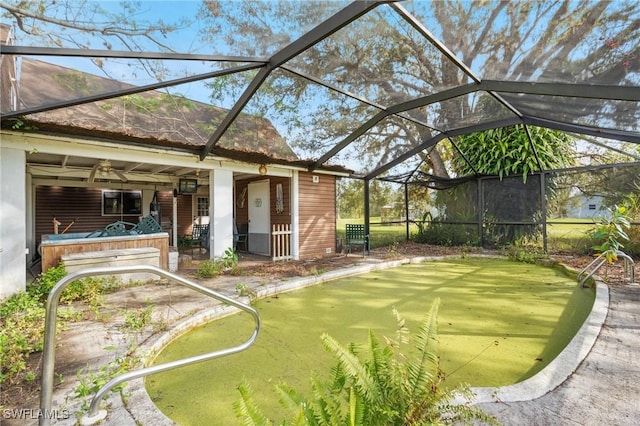 view of yard with glass enclosure