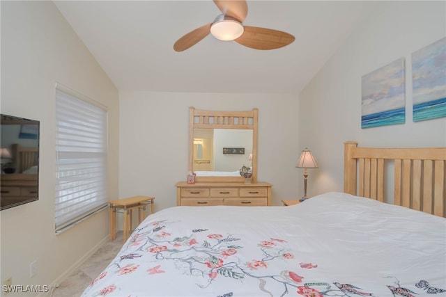 bedroom featuring light carpet, vaulted ceiling, and ceiling fan