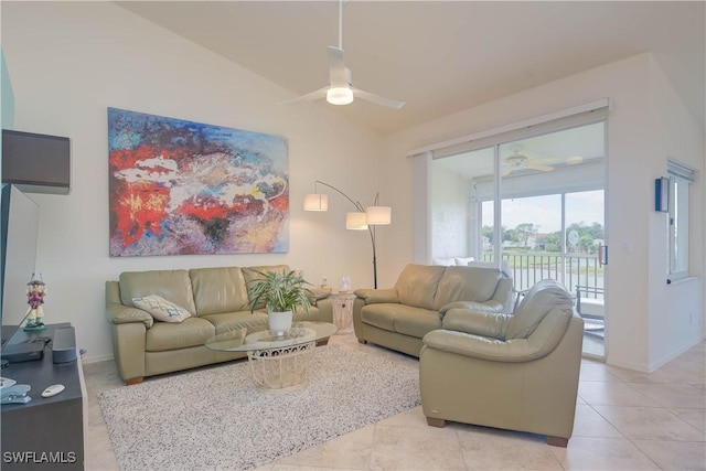 tiled living room with ceiling fan and vaulted ceiling