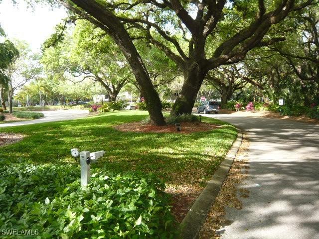 view of home's community with a yard