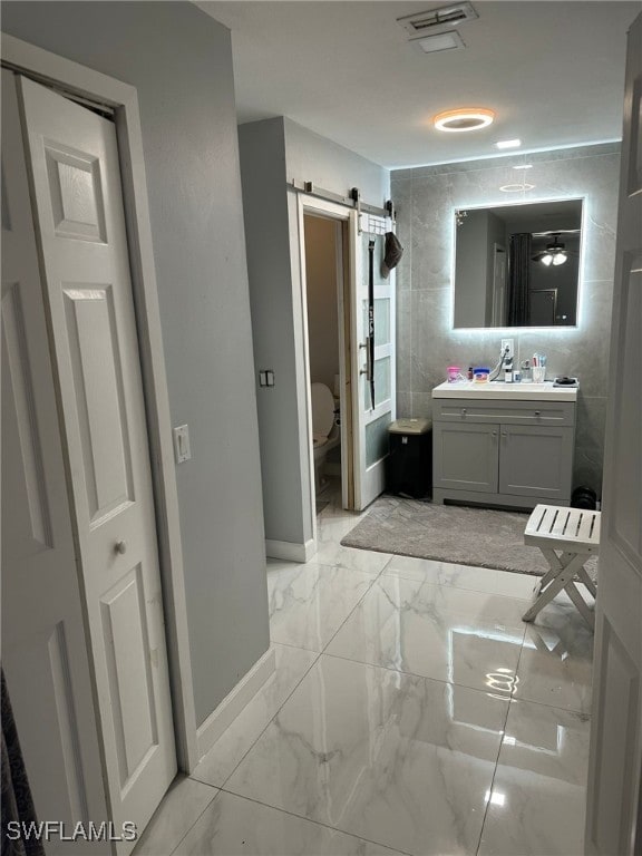 bathroom with toilet and vanity