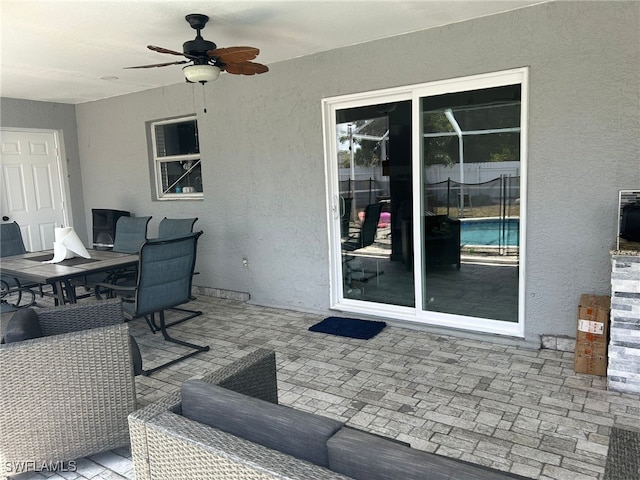 view of patio featuring ceiling fan