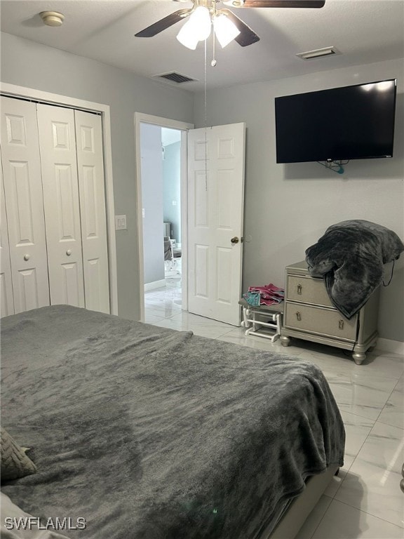 bedroom featuring a closet and ceiling fan