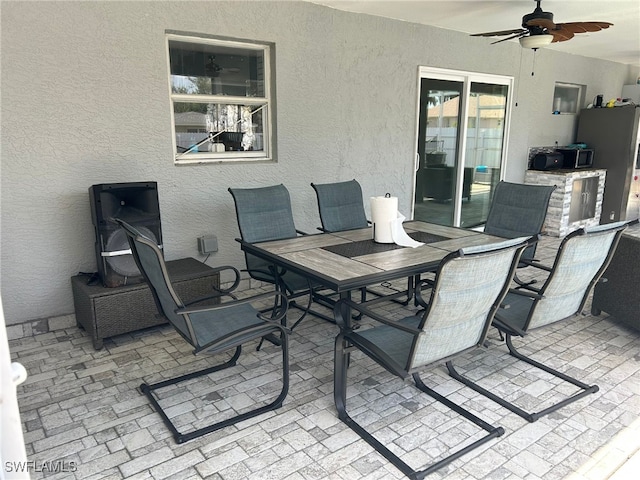 view of patio / terrace featuring ceiling fan