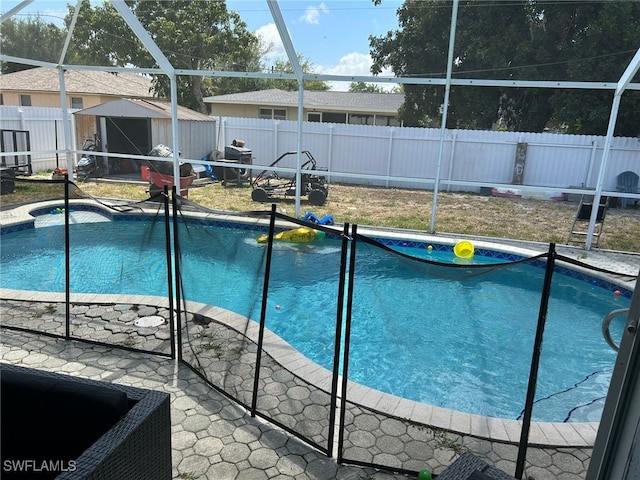 view of swimming pool featuring a storage unit