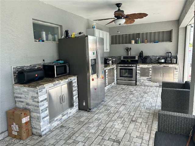 kitchen featuring appliances with stainless steel finishes and ceiling fan