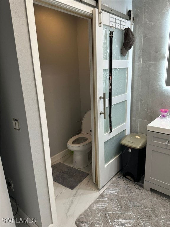 bathroom with vanity and toilet