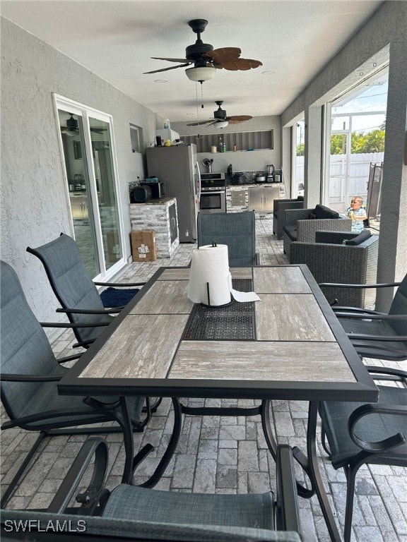 view of patio / terrace featuring ceiling fan