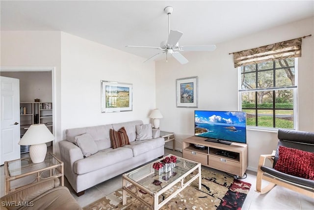 tiled living room featuring ceiling fan