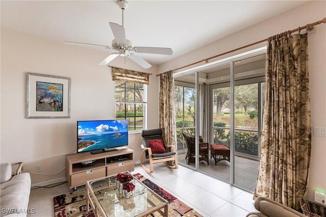 living room featuring ceiling fan and light tile patterned floors