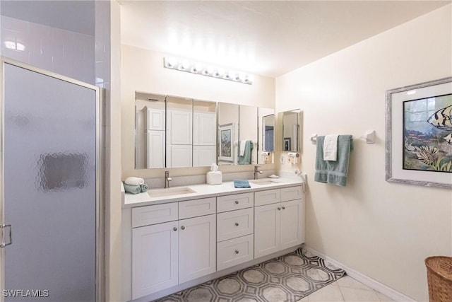 bathroom featuring vanity, tile patterned flooring, and a shower with door