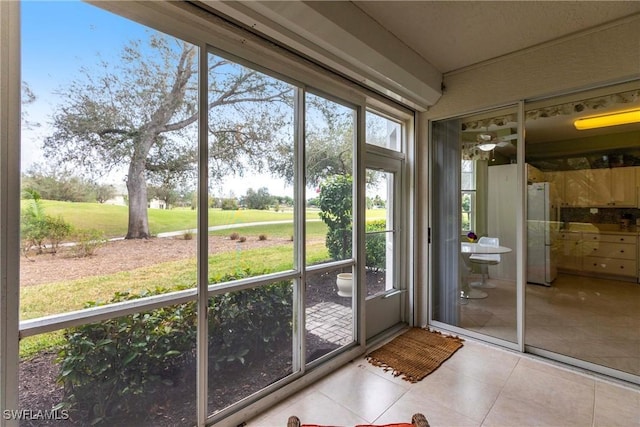 unfurnished sunroom with plenty of natural light