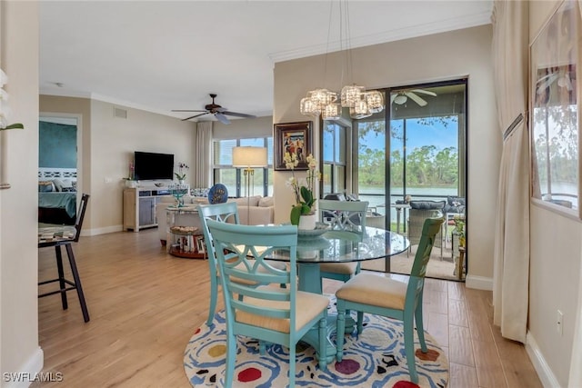 1296 Verde Dr Unit 3, Naples, FL 34105 - dining space with light wood-style floors, crown molding, a ceiling fan, baseboards, and a chandelier