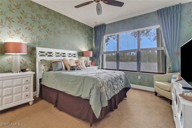 bedroom with carpet, ornamental molding, a ceiling fan, baseboards, and wallpapered walls