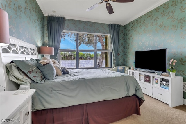 bedroom with ornamental molding, a ceiling fan, light carpet, and wallpapered walls