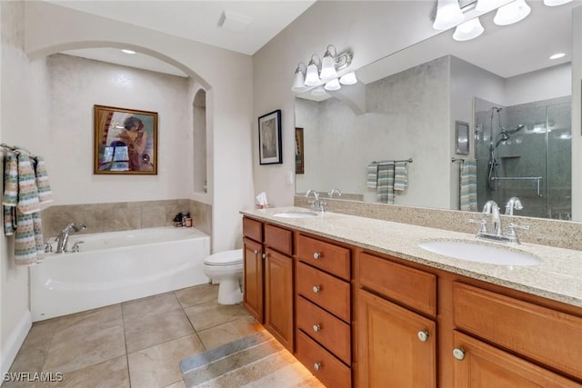 1296 Verde Dr Unit 3, Naples, FL 34105 - bathroom with a stall shower, tile patterned flooring, double vanity, a garden tub, and toilet