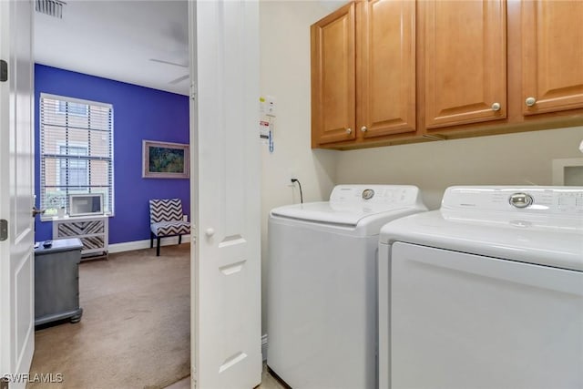 1296 Verde Dr Unit 3, Naples, FL 34105 - washroom with cabinet space, light carpet, washer and dryer, and baseboards
