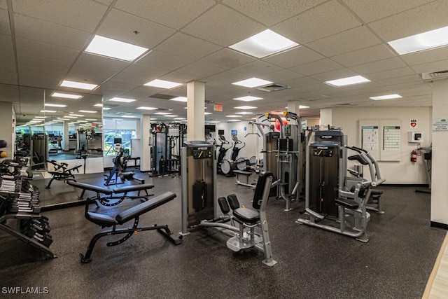 exercise room featuring a drop ceiling